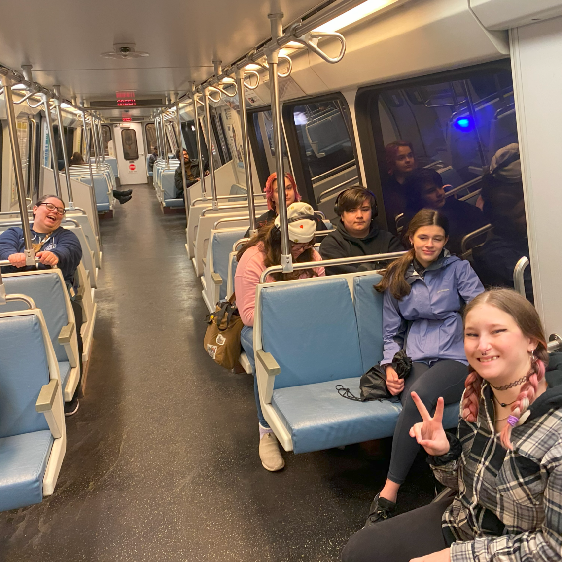 Students and a teacher on the Metro in Washington, DC.