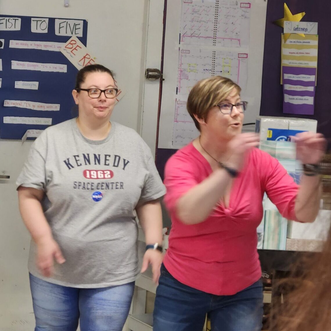 Myriah and MaryBeth participate in an improv game.