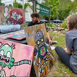 Students with art pose on the front lawn of TNS