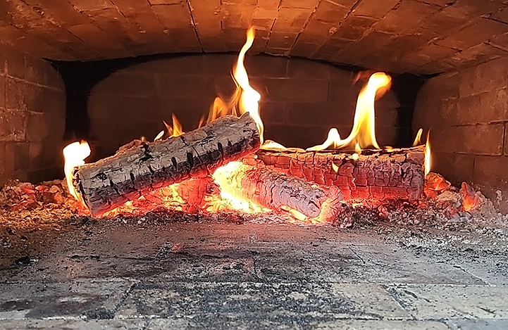 inside the pizza oven, a fire!