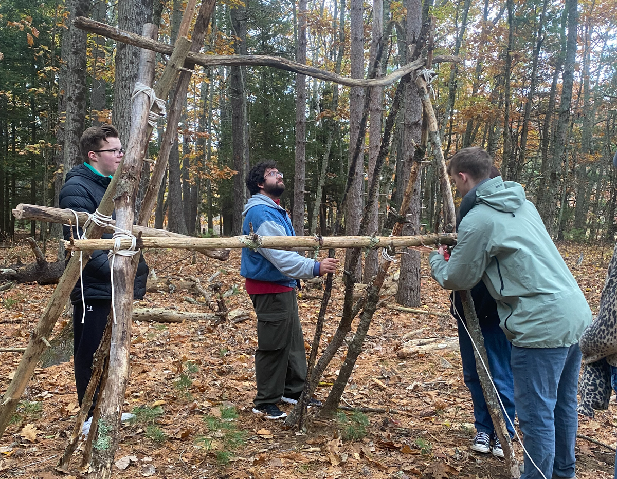 Students work on an A-Frame shelter