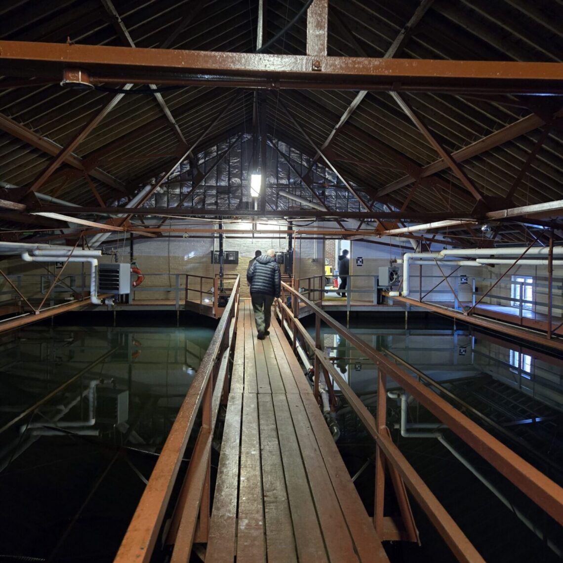 Inside the water treatment plant, what appears to be a dock is a catwalk above a water storage tank.